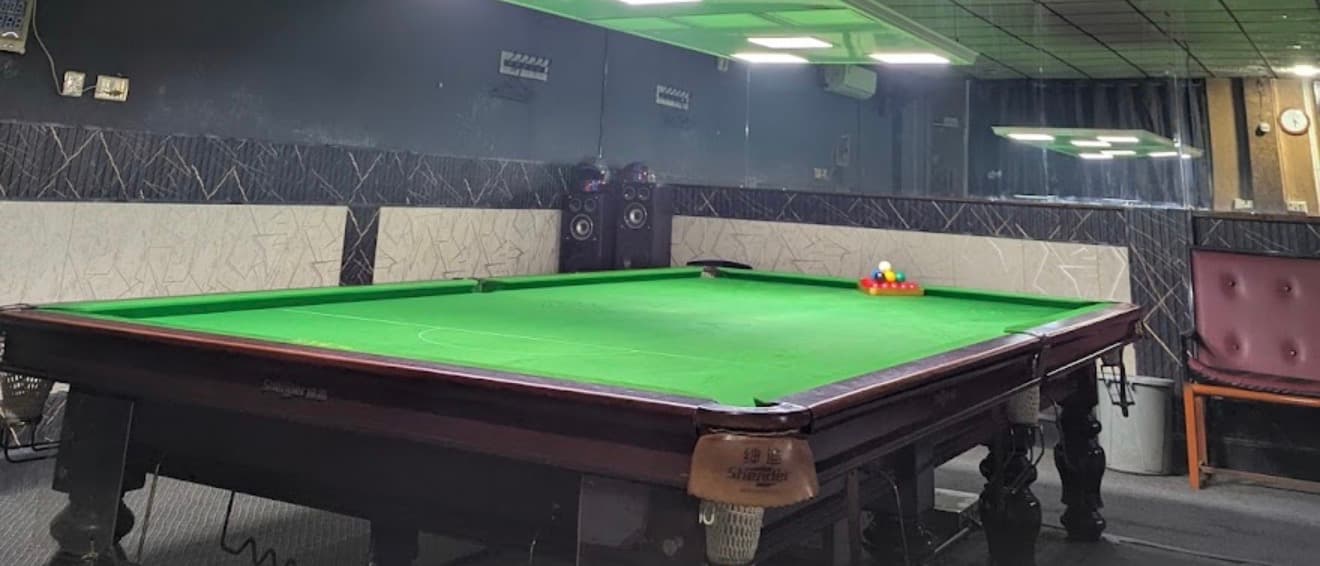 Wooden snooker table in CueMaster’s playing room